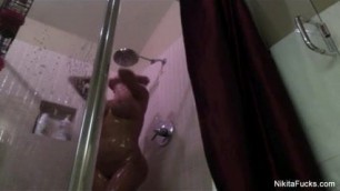 Nikita shaves her pussy in the shower