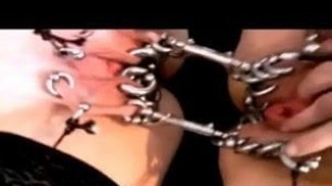 Two heavy pierced pussies in bondage